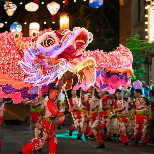 Dancers manipulate a giant, illuminated dragon during San Francisco's Lunar New Year Parade.